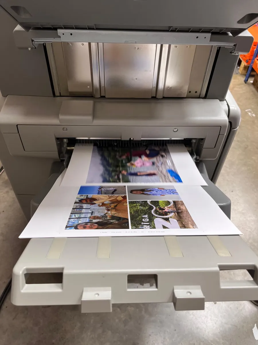 Inside pages of the book coming out of the press